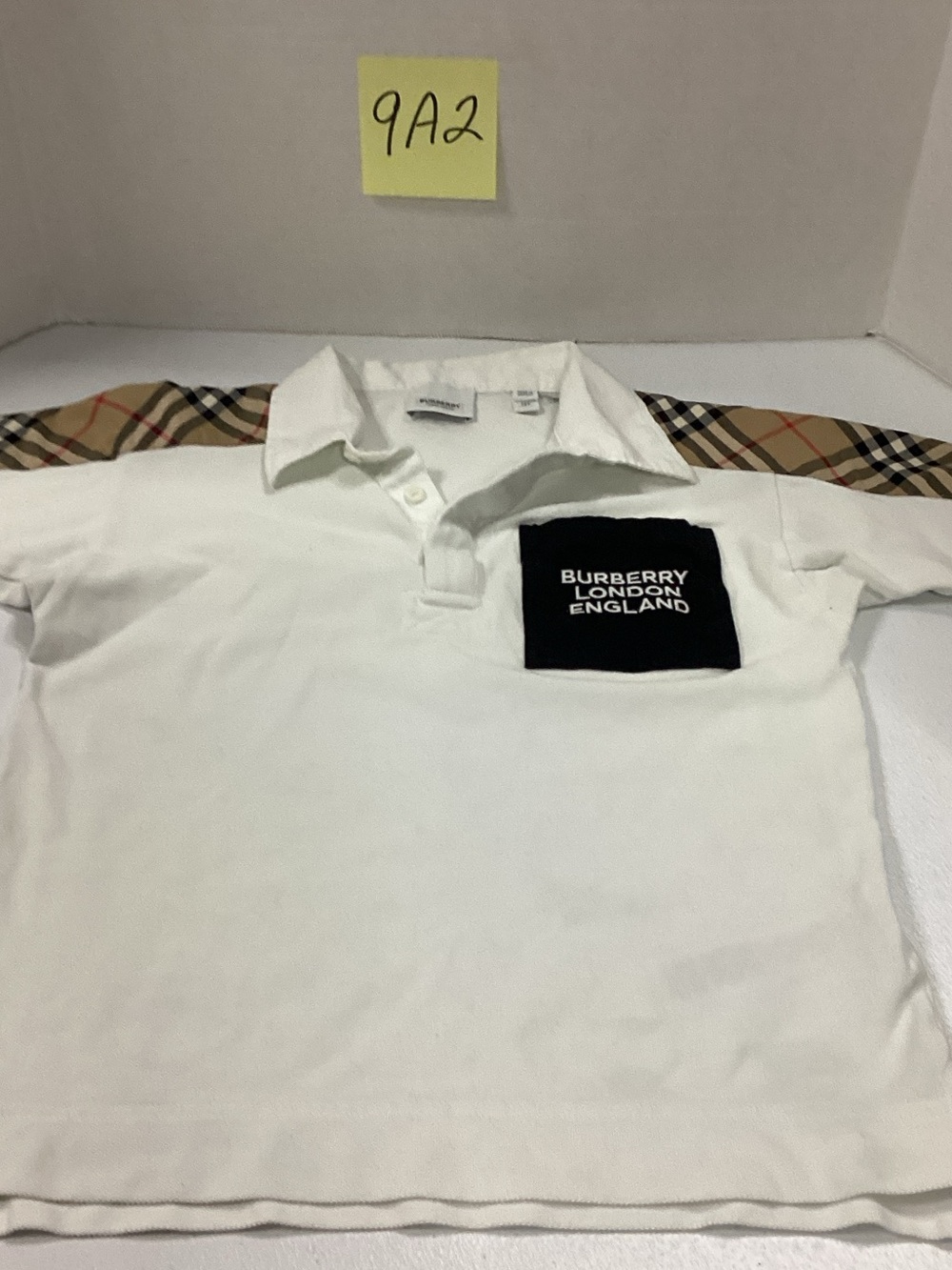 Burberry White Kids Polo with Black Logo Pocket and Check Trim